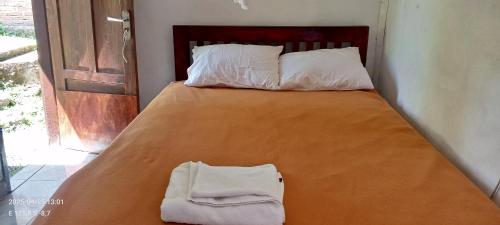 Katil atau katil-katil dalam bilik di Kelimutu View Bungalows