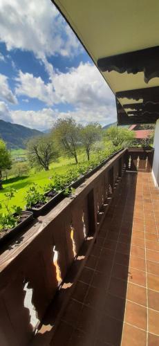 a balcony of a house with a view of a field at Fruhstuckspension Bischof i d Wiesen in Sankt Peter am Kammersberg