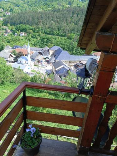 a view of a town from the balcony of a house at Privatni smještaj Kurtalija in Jajce