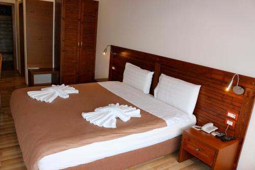 Postel nebo postele na pokoji v ubytování Hotel Kodra