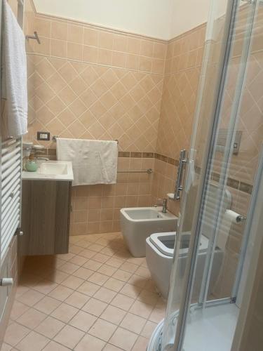 a bathroom with a toilet and a sink at B&B Carafa in Bovino