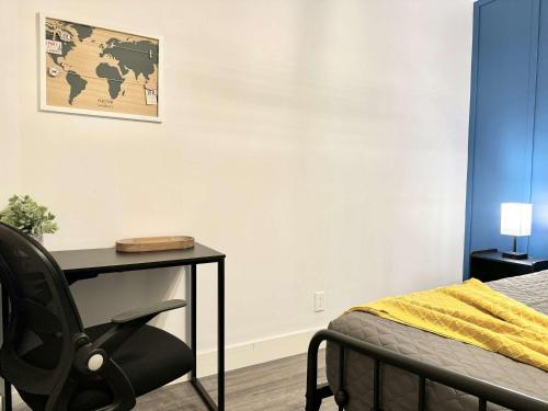 a bedroom with a desk and a chair next to a bed at HAPPY HOUR - Condo Water Park in Beaupré