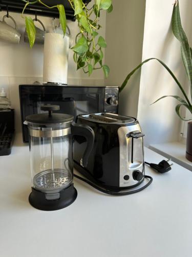 a coffee maker and a blender on a counter at Apartment for friends & families in Tallinn