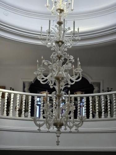 a chandelier hanging from the ceiling in a room at Palacio Suites Marbella in Marbella