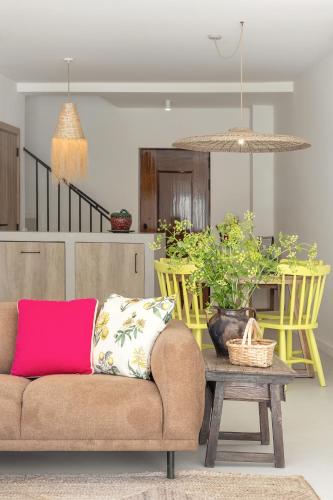 a living room with a couch and a table at Casa da Rosalina in Marvão