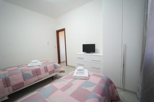Postel nebo postele na pokoji v ubytování Da Don Antonio