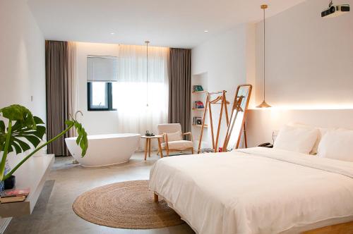 Postel nebo postele na pokoji v ubytování Xingle Hotel-Suzhou Guanqian Street Pingjiang Road
