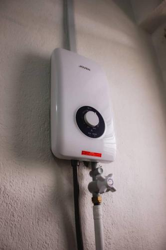 a camera is attached to a wall at Hana Homestay in Tawau