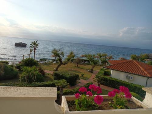 a view of the ocean from the balcony of a resort at Borgo di Riaci Beach Resort in Santa Domenica