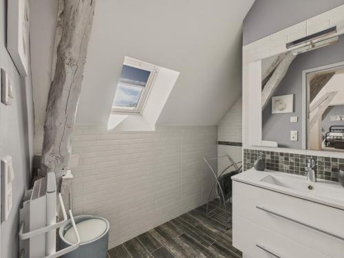 a bathroom with a sink and a toilet and a window at Belle maison pour 6 - Piscine - Dordogne in Saint-Julien-de-Lampon
