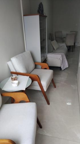 a living room with two couches and a couch at Spectacular Agriões Location in Teresópolis