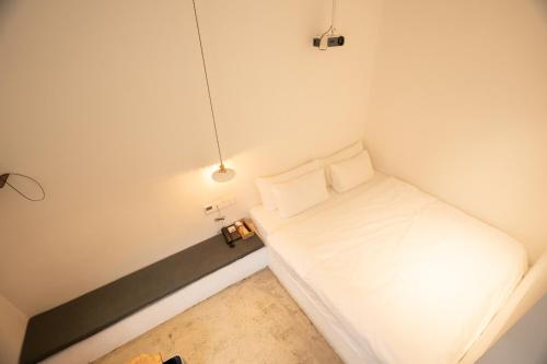 Ένα ή περισσότερα κρεβάτια σε δωμάτιο στο Xingle Hotel-Suzhou Guanqian Street Pingjiang Road