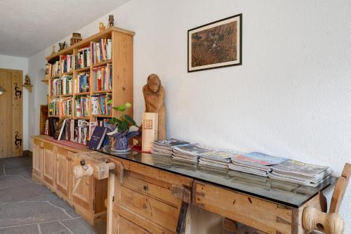 a room with a wooden desk with books on it at Prackfolerhof in Fie allo Sciliar