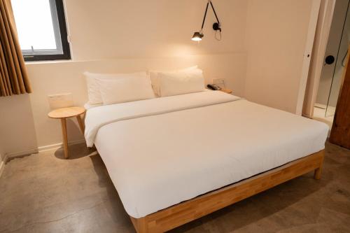 Ένα ή περισσότερα κρεβάτια σε δωμάτιο στο Xingle Hotel-Suzhou Guanqian Street Pingjiang Road