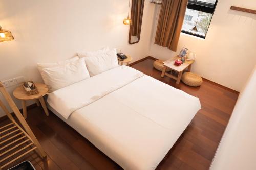 Ένα ή περισσότερα κρεβάτια σε δωμάτιο στο Xingle Hotel-Suzhou Guanqian Street Pingjiang Road