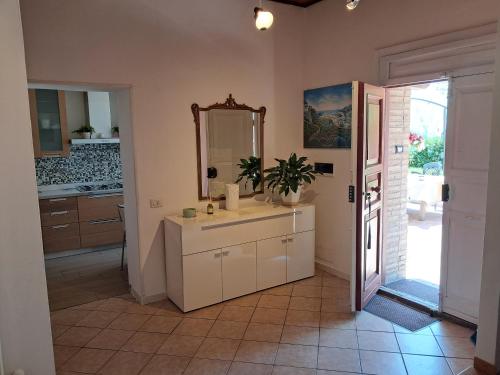 a bathroom with a sink and a mirror at Holiday Inn Mirida in Pesaro