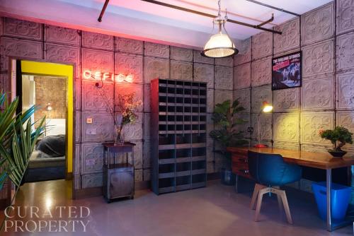 a room with a table and a dining room at Amazingly Luxurious Loft Apartment, Soho - 3 Bedrooms, 2 Bath & Office in London