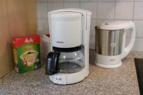 a white blender sitting on top of a counter at Gästehaus Gerda in Bad Peterstal-Griesbach