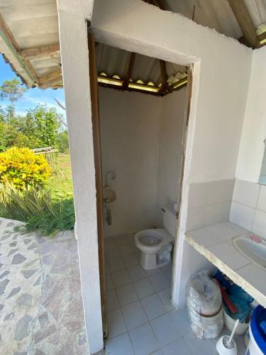 a bathroom with a toilet and a sink at Casa Finca la Parcela in San Onofre