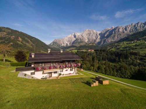 an aerial view of a house in the mountains at Haus Rainer in Mühlbach am Hochkönig