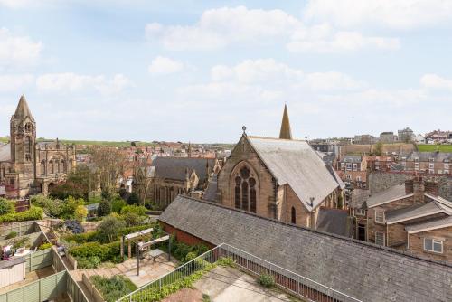 an aerial view of a church in a city at Newton House - Free Parking in Whitby