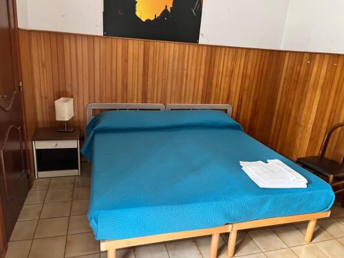 Postel nebo postele na pokoji v ubytování Domus Getsemani