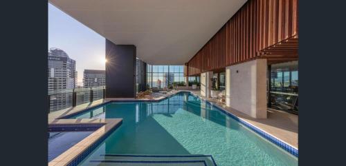 a swimming pool on the roof of a building at Stylish Ocean View Apartments in Casino Towers in Gold Coast