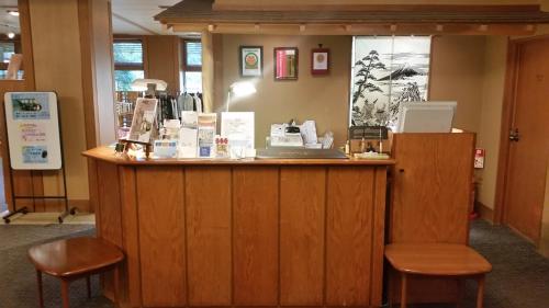 a counter with two stools in a room at Ryuguden in Hakone