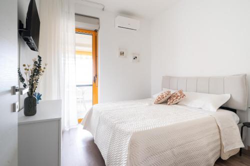 En eller flere senge i et værelse på Casa Levante by Wonderful Italy