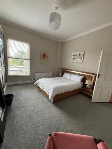 a bedroom with a large bed and a window at North Strand Road Dublin City in Dublin