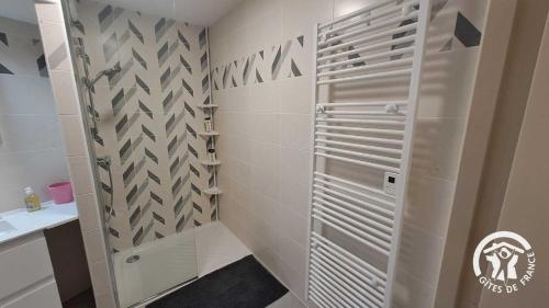 a shower with a glass door in a bathroom at Le rodin in Albi