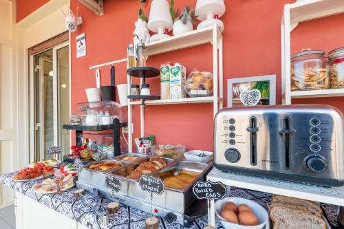 a bakery counter with pastries and breads on a table at Ciccio Rooms and breakfast - Self check-in in Palermo