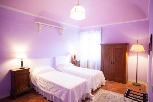 Ένα ή περισσότερα κρεβάτια σε δωμάτιο στο Agriturismo Poggiolo