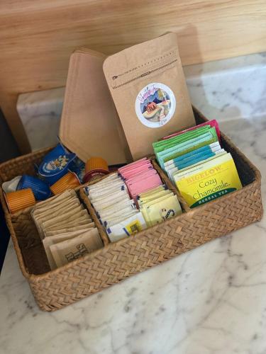a basket filled with books and a box on a counter at Cozy Cabin Getaway! in Fancy Gap