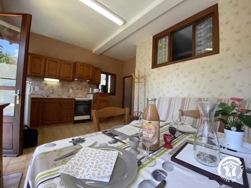 a kitchen with a table with a white table cloth at Ribelles in Eus