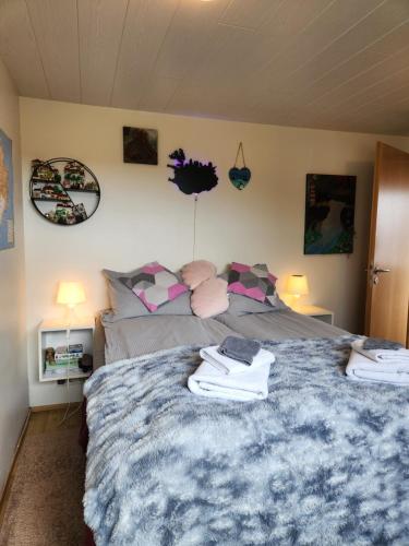 a bedroom with a bed and two pillows at LAVA Studio Keflavik in Keflavík