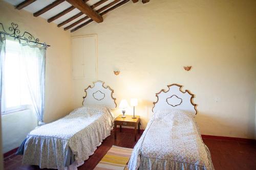 Ένα ή περισσότερα κρεβάτια σε δωμάτιο στο Agriturismo Poggiolo