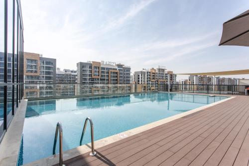 a swimming pool on the roof of a building at STAY BY LATINEM Luxury 1BR Holiday Home W 2709 Near Burj Khalifa in Dubai