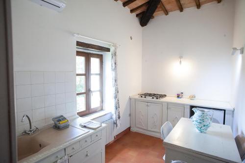Katil atau katil-katil dalam bilik di Agriturismo Poggiolo