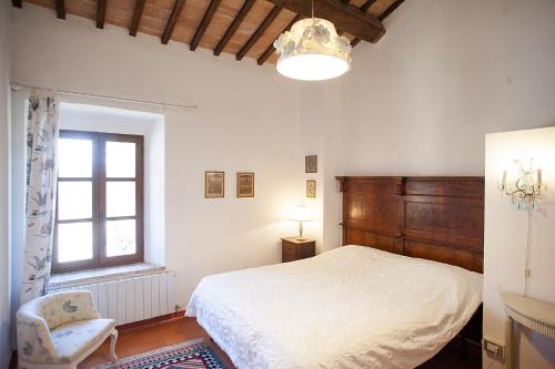 Ένα ή περισσότερα κρεβάτια σε δωμάτιο στο Agriturismo Poggiolo