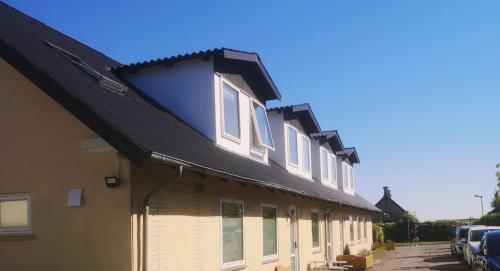 a building with a black roof at HK Homes Apartments in Aarhus