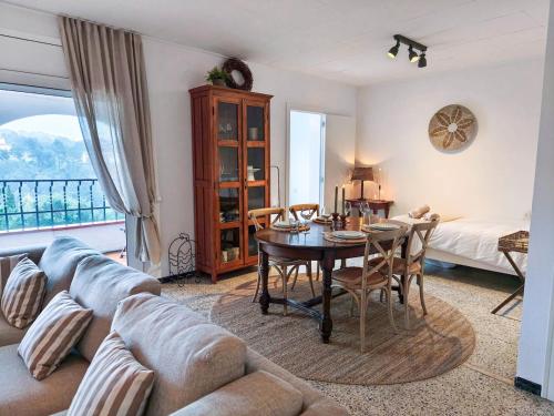 a living room with a couch and a table at Villa Marie, 8 pers, green zone, private in GRO