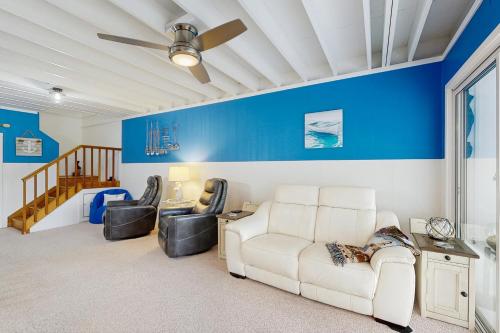 a living room with a white couch and chairs at Mallard Lakes - 142 Cardinal in Selbyville