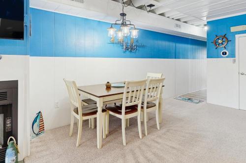 a dining room with a table and chairs at Mallard Lakes - 142 Cardinal in Selbyville