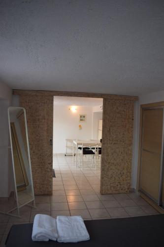 a room with a dining room and a table at Traditional apartment in nature in Kouvaláta
