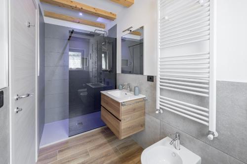 a bathroom with a toilet and a sink and a shower at Agriturismo Rouna in Duino