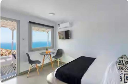 Ένα ή περισσότερα κρεβάτια σε δωμάτιο στο Doras studios mykonos