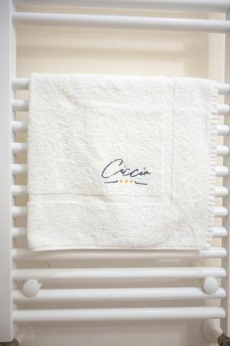a towel on a towel rack in a refrigerator at Ciccio Rooms and breakfast - Self check-in in Palermo