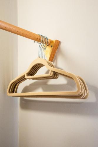 a wooden hanger with a bunch of wires at Ciccio Rooms and breakfast - Self check-in in Palermo
