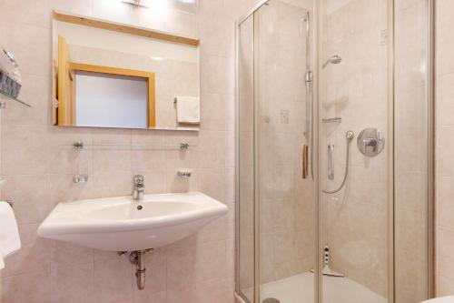 a bathroom with a sink and a shower at Hofanger in Lagundo